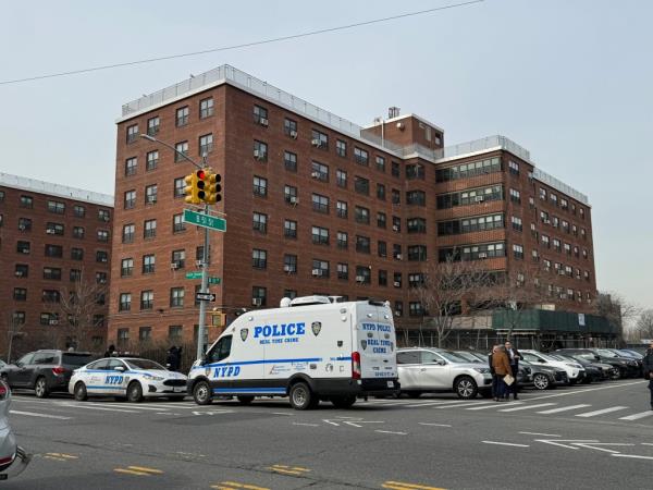 Police cars parked outside a building in Rockaway Queens, wher<em></em>e police fatally shot a man inside an apartment.