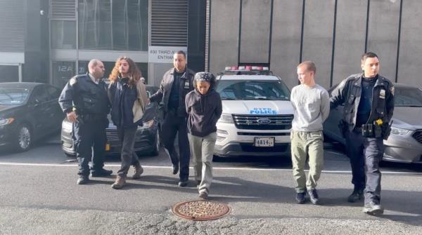 NYPD officers with protestors arrested the Queens-Midtown Tunnel.